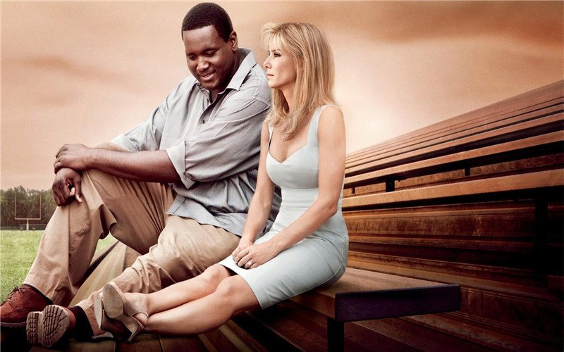 Sandra Bullock and Michael Oher star in The Blind Side.